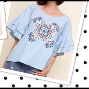 Light blue top with embroidery